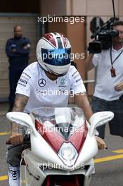 Lewis Hamilton (GBR) Mercedes AMG F1 arrives in the paddock on his motorbike. 21.05.2014. Formula 1 World Championship, Rd 6, Monaco Grand Prix, Monte Carlo, Monaco, Preparation Day.