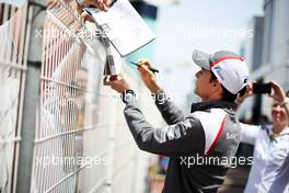 Esteban Gutierrez (MEX) Sauber signs autographs for the fans. 21.05.2014. Formula 1 World Championship, Rd 6, Monaco Grand Prix, Monte Carlo, Monaco, Preparation Day.
