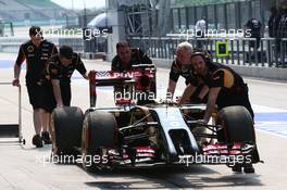 The Lotus F1 E22 of Romain Grosjean (FRA) Lotus F1 Team is pushed down the pit lane after stopping on track. 28.03.2014. Formula 1 World Championship, Rd 2, Malaysian Grand Prix, Sepang, Malaysia, Friday.