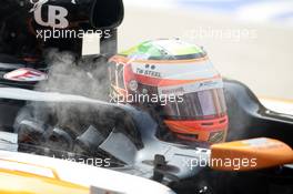 Sergio Perez (MEX) Sahara Force India F1 VJM07 smoking in the pits. 28.03.2014. Formula 1 World Championship, Rd 2, Malaysian Grand Prix, Sepang, Malaysia, Friday.