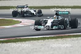Lewis Hamilton (GBR) Mercedes AMG F1 W05 leads Jenson Button (GBR) McLaren MP4-29. 28.03.2014. Formula 1 World Championship, Rd 2, Malaysian Grand Prix, Sepang, Malaysia, Friday.