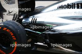 Kevin Magnussen (DEN) McLaren MP4-29 is pushed down the pit lane after stopping on track - exhaust and engine cover detail. 28.03.2014. Formula 1 World Championship, Rd 2, Malaysian Grand Prix, Sepang, Malaysia, Friday.