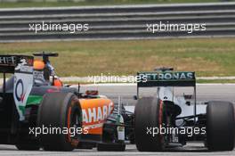 Lewis Hamilton (GBR) Mercedes AMG F1 W05 leads Nico Hulkenberg (GER) Sahara Force India F1 VJM07. 28.03.2014. Formula 1 World Championship, Rd 2, Malaysian Grand Prix, Sepang, Malaysia, Friday.