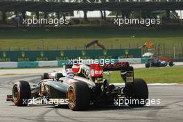 Romain Grosjean (FRA) Lotus F1 E22 stops on the circuit. 28.03.2014. Formula 1 World Championship, Rd 2, Malaysian Grand Prix, Sepang, Malaysia, Friday.