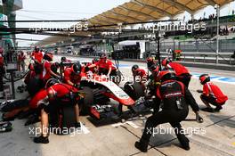 Jules Bianchi (FRA) Marussia F1 Team MR03 practices a pit stop. 28.03.2014. Formula 1 World Championship, Rd 2, Malaysian Grand Prix, Sepang, Malaysia, Friday.