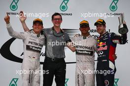 1st place Lewis Hamilton (GBR) Mercedes AMG F1 2nd place Nico Rosberg (GER) Mercedes AMG F1 and 3rd place Sebastian Vettel (GER) Red Bull Racing. 30.03.2014. Formula 1 World Championship, Rd 2, Malaysian Grand Prix, Sepang, Malaysia, Sunday.