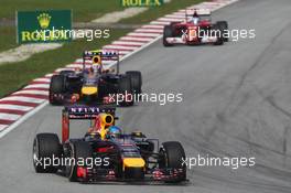 Sebastian Vettel (GER) Red Bull Racing RB10 leads Daniel Ricciardo (AUS) Red Bull Racing RB10. 30.03.2014. Formula 1 World Championship, Rd 2, Malaysian Grand Prix, Sepang, Malaysia, Sunday.