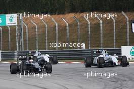 (L to R): Kevin Magnussen (DEN) McLaren MP4-29 and Felipe Massa (BRA) Williams FW36 battle for position. 30.03.2014. Formula 1 World Championship, Rd 2, Malaysian Grand Prix, Sepang, Malaysia, Sunday.