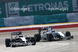 Kevin Magnussen (DEN) McLaren MP4-29 and Felipe Massa (BRA) Williams FW36 battle for position. 30.03.2014. Formula 1 World Championship, Rd 2, Malaysian Grand Prix, Sepang, Malaysia, Sunday.