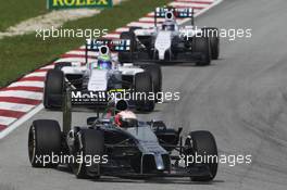 Kevin Magnussen (DEN) McLaren MP4-29 leads Felipe Massa (BRA) Williams FW36 and Valtteri Bottas (FIN) Williams FW36. 30.03.2014. Formula 1 World Championship, Rd 2, Malaysian Grand Prix, Sepang, Malaysia, Sunday.