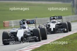 Valtteri Bottas (FIN) Williams FW36 leads Kevin Magnussen (DEN) McLaren MP4-29. 30.03.2014. Formula 1 World Championship, Rd 2, Malaysian Grand Prix, Sepang, Malaysia, Sunday.