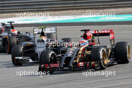Romain Grosjean (FRA), Lotus F1 Team and Esteban Gutierrez (MEX), Sauber F1 Team  30.03.2014. Formula 1 World Championship, Rd 2, Malaysian Grand Prix, Sepang, Malaysia, Sunday.