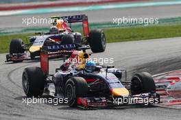 Sebastian Vettel (GER) Red Bull Racing RB10 leads Daniel Ricciardo (AUS) Red Bull Racing. 30.03.2014. Formula 1 World Championship, Rd 2, Malaysian Grand Prix, Sepang, Malaysia, Sunday.