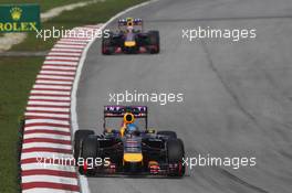 Sebastian Vettel (GER) Red Bull Racing RB10 leads team mate Daniel Ricciardo (AUS) Red Bull Racing RB10. 30.03.2014. Formula 1 World Championship, Rd 2, Malaysian Grand Prix, Sepang, Malaysia, Sunday.