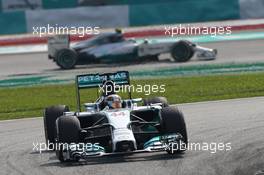 Lewis Hamilton (GBR) Mercedes AMG F1 W05 leads Nico Rosberg (GER) Mercedes AMG F1 W05. 30.03.2014. Formula 1 World Championship, Rd 2, Malaysian Grand Prix, Sepang, Malaysia, Sunday.