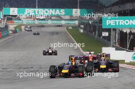 Sebastian Vettel (GER) Red Bull Racing RB10 leads team mate Daniel Ricciardo (AUS) Red Bull Racing RB10. 30.03.2014. Formula 1 World Championship, Rd 2, Malaysian Grand Prix, Sepang, Malaysia, Sunday.