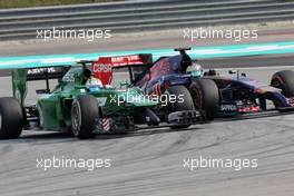 Marcus Ericsson (SWE), Caterham F1 Team and Jean-Eric Vergne (FRA), Scuderia Toro Rosso   30.03.2014. Formula 1 World Championship, Rd 2, Malaysian Grand Prix, Sepang, Malaysia, Sunday.