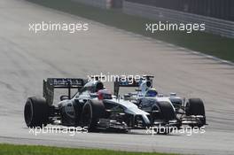 Jenson Button (GBR) McLaren MP4-29 and Felipe Massa (BRA) Williams FW36 battle for position. 30.03.2014. Formula 1 World Championship, Rd 2, Malaysian Grand Prix, Sepang, Malaysia, Sunday.