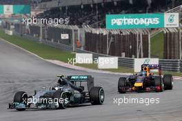 Nico Rosberg (GER), Mercedes AMG F1 Team and Sebastian Vettel (GER), Red Bull Racing  30.03.2014. Formula 1 World Championship, Rd 2, Malaysian Grand Prix, Sepang, Malaysia, Sunday.