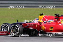 Fernando Alonso (ESP), Scuderia Ferrari and Sebastian Vettel (GER), Red Bull Racing  30.03.2014. Formula 1 World Championship, Rd 2, Malaysian Grand Prix, Sepang, Malaysia, Sunday.