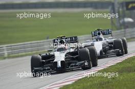 Kevin Magnussen (DEN) McLaren MP4-29 leads Valtteri Bottas (FIN) Williams FW36. 30.03.2014. Formula 1 World Championship, Rd 2, Malaysian Grand Prix, Sepang, Malaysia, Sunday.