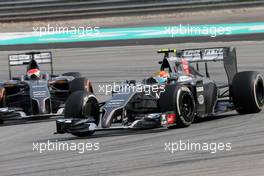 Esteban Gutierrez (MEX), Sauber F1 Team and Adrian Sutil (GER), Sauber F1 Team  30.03.2014. Formula 1 World Championship, Rd 2, Malaysian Grand Prix, Sepang, Malaysia, Sunday.