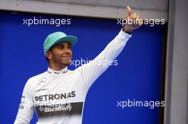 Lewis Hamilton (GBR) Mercedes AMG F1 celebrates his pole position in parc ferme. 29.03.2014. Formula 1 World Championship, Rd 2, Malaysian Grand Prix, Sepang, Malaysia, Saturday.