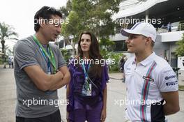 Jari Litmanen (FIN) Former Football Player (Left) with Valtteri Bottas (FIN) Williams (Right). 29.03.2014. Formula 1 World Championship, Rd 2, Malaysian Grand Prix, Sepang, Malaysia, Saturday.