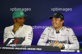 The post qualifying FIA Press Conference (L to R): Lewis Hamilton (GBR) Mercedes AMG F1, pole position; Nico Rosberg (GER) Mercedes AMG F1, third. 29.03.2014. Formula 1 World Championship, Rd 2, Malaysian Grand Prix, Sepang, Malaysia, Saturday.