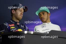 (L to R): Sebastian Vettel (GER) Red Bull Racing with pole sitter Lewis Hamilton (GBR) Mercedes AMG F1 in the post qualifying FIA Press Conference. 29.03.2014. Formula 1 World Championship, Rd 2, Malaysian Grand Prix, Sepang, Malaysia, Saturday.