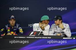 The post qualifying FIA Press Conference (L to R): Sebastian Vettel (GER) Red Bull Racing, second; Lewis Hamilton (GBR) Mercedes AMG F1, pole position; Nico Rosberg (GER) Mercedes AMG F1, third. 29.03.2014. Formula 1 World Championship, Rd 2, Malaysian Grand Prix, Sepang, Malaysia, Saturday.