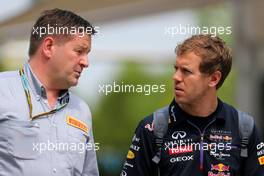 Paul Hembery (GBR) Pirelli Motorsport Director and Sebastian Vettel (GER), Red Bull Racing   29.03.2014. Formula 1 World Championship, Rd 2, Malaysian Grand Prix, Sepang, Malaysia, Saturday.