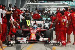 Fernando Alonso (ESP) Ferrari F14-T practices a pit stop. 29.03.2014. Formula 1 World Championship, Rd 2, Malaysian Grand Prix, Sepang, Malaysia, Saturday.