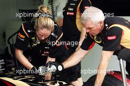 Lotus F1 Team mechanics work on the Lotus F1 E22.