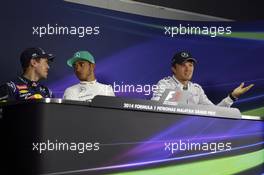 The post qualifying FIA Press Conference (L to R): Sebastian Vettel (GER) Red Bull Racing, second; Lewis Hamilton (GBR) Mercedes AMG F1, pole position; Nico Rosberg (GER) Mercedes AMG F1, third. 29.03.2014. Formula 1 World Championship, Rd 2, Malaysian Grand Prix, Sepang, Malaysia, Saturday.