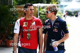 (L to R): Pedro De La Rosa (ESP) Ferrari Development Driver with Sebastian Vettel (GER) Red Bull Racing. 30.03.2014. Formula 1 World Championship, Rd 2, Malaysian Grand Prix, Sepang, Malaysia, Sunday.