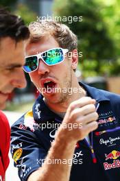 (L to R): Pedro De La Rosa (ESP) Ferrari Development Driver with Sebastian Vettel (GER) Red Bull Racing. 30.03.2014. Formula 1 World Championship, Rd 2, Malaysian Grand Prix, Sepang, Malaysia, Sunday.