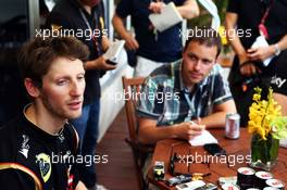Romain Grosjean (FRA) Lotus F1 Team with the media. 27.03.2014. Formula 1 World Championship, Rd 2, Malaysian Grand Prix, Sepang, Malaysia, Thursday.