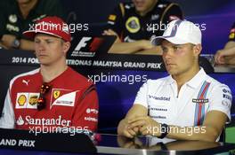 (L to R): Kimi Raikkonen (FIN) Ferrari and Valtteri Bottas (FIN) Williams in the FIA Press Conference. 27.03.2014. Formula 1 World Championship, Rd 2, Malaysian Grand Prix, Sepang, Malaysia, Thursday.