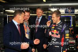 Dmitry Kozak (RUS) Russian Deputy Prime Minister (Left) with Sebastian Vettel (GER) Red Bull Racing (Right). 10.10.2014. Formula 1 World Championship, Rd 16, Russian Grand Prix, Sochi Autodrom, Sochi, Russia, Practice Day.
