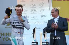 Nico Rosberg (GER) Mercedes AMG F1 W05 with Vladimir Putin (RUS) Russian Federation President. 12.10.2014. Formula 1 World Championship, Rd 16, Russian Grand Prix, Sochi Autodrom, Sochi, Russia, Race Day.