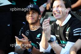 Lewis Hamilton (GBR) Mercedes AMG F1 celebrates winning the 2014 Constructors' Championship with Toto Wolff (GER) Mercedes AMG F1 Shareholder and Executive Director and the team. 12.10.2014. Formula 1 World Championship, Rd 16, Russian Grand Prix, Sochi Autodrom, Sochi, Russia, Race Day.