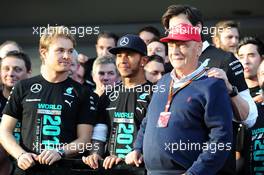 (L to R): Nico Rosberg (GER) Mercedes AMG F1; Lewis Hamilton (GBR) Mercedes AMG F1 and Niki Lauda (AUT) Mercedes Non-Executive Chairman celebrate winning the 2014 Constructors' Championship with the team. 12.10.2014. Formula 1 World Championship, Rd 16, Russian Grand Prix, Sochi Autodrom, Sochi, Russia, Race Day.