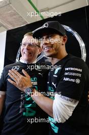 Lewis Hamilton (GBR) Mercedes AMG F1 celebrates winning the 2014 Constructors' Championship with the team. 12.10.2014. Formula 1 World Championship, Rd 16, Russian Grand Prix, Sochi Autodrom, Sochi, Russia, Race Day.