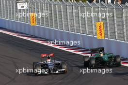 Adrian Sutil (GER), Sauber F1 Team and Kamui Kobayashi (JPN), Caterham F1 Team  12.10.2014. Formula 1 World Championship, Rd 16, Russian Grand Prix, Sochi Autodrom, Sochi, Russia, Race Day.