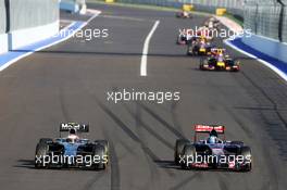 Kevin Magnussen (DEN) McLaren MP4-29 and Jean-Eric Vergne (FRA) Scuderia Toro Rosso STR9 battle for position. 12.10.2014. Formula 1 World Championship, Rd 16, Russian Grand Prix, Sochi Autodrom, Sochi, Russia, Race Day.