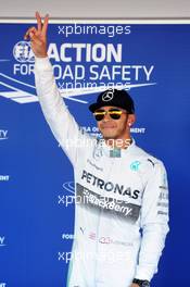 Lewis Hamilton (GBR) Mercedes AMG F1 celebrates his pole position in parc ferme. 11.10.2014. Formula 1 World Championship, Rd 16, Russian Grand Prix, Sochi Autodrom, Sochi, Russia, Qualifying Day.