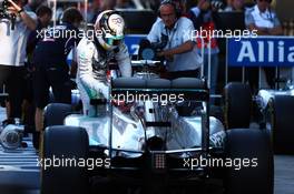 Lewis Hamilton (GBR) Mercedes AMG F1 W05 in parc ferme. 11.10.2014. Formula 1 World Championship, Rd 16, Russian Grand Prix, Sochi Autodrom, Sochi, Russia, Qualifying Day.