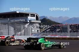 Marcus Ericsson (SWE) Caterham CT05 and Romain Grosjean (FRA) Lotus F1 E22. 11.10.2014. Formula 1 World Championship, Rd 16, Russian Grand Prix, Sochi Autodrom, Sochi, Russia, Qualifying Day.