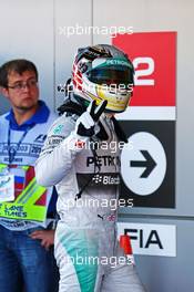 Lewis Hamilton (GBR) Mercedes AMG F1 celebrates his pole position in parc ferme. 11.10.2014. Formula 1 World Championship, Rd 16, Russian Grand Prix, Sochi Autodrom, Sochi, Russia, Qualifying Day.